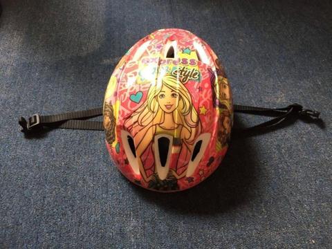 A Barbie cycle helmet in fairly good condition