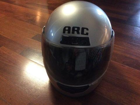 Motorbike helmet, excellent condition, medium, silver, barely used
