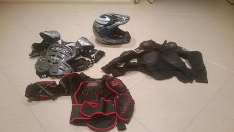 Motorcycle body armor and large motocross helmet
