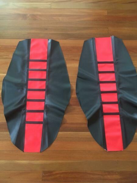 New dirtbike seat covers $30 each red &; black. 2 types gripper