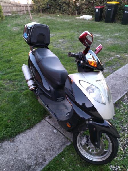 Scooter in Excellent condition with helmet