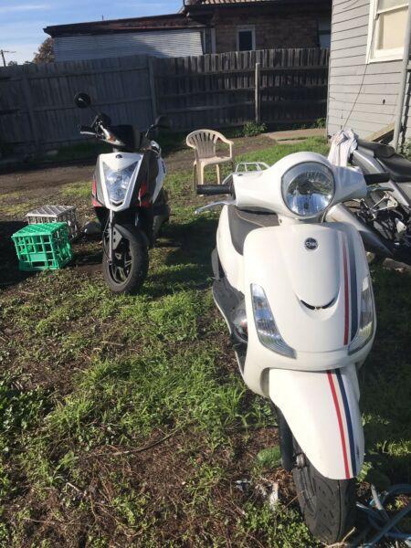 2 Sym scooters