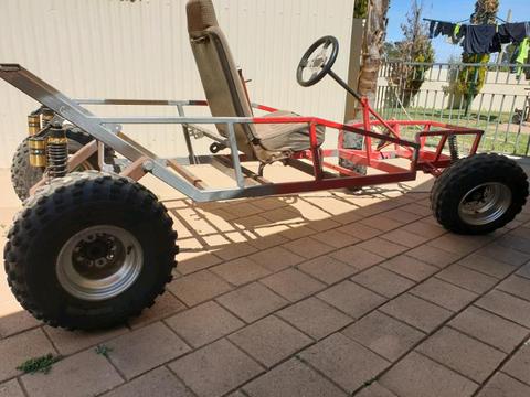Buggy with roll cage and engine