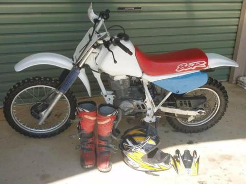 Honda XR80 kids have outgrown comes with helmet and boots