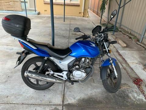 Blue Honda motorcycle CB125E